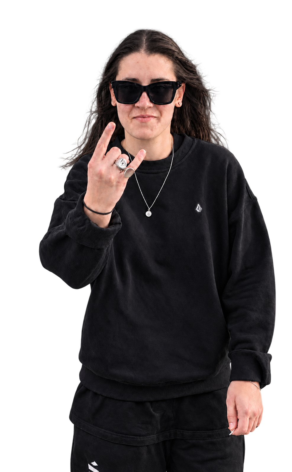 Luna Fino wearing sunglasses and making a rock hand gesture